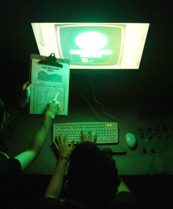 Players enjoying escape room key in answer for puzzle