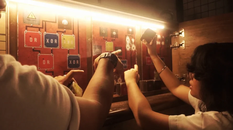 Group of players working together to solve puzzle at Breakout Escape Room