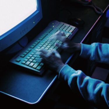 hand typing on keyboard